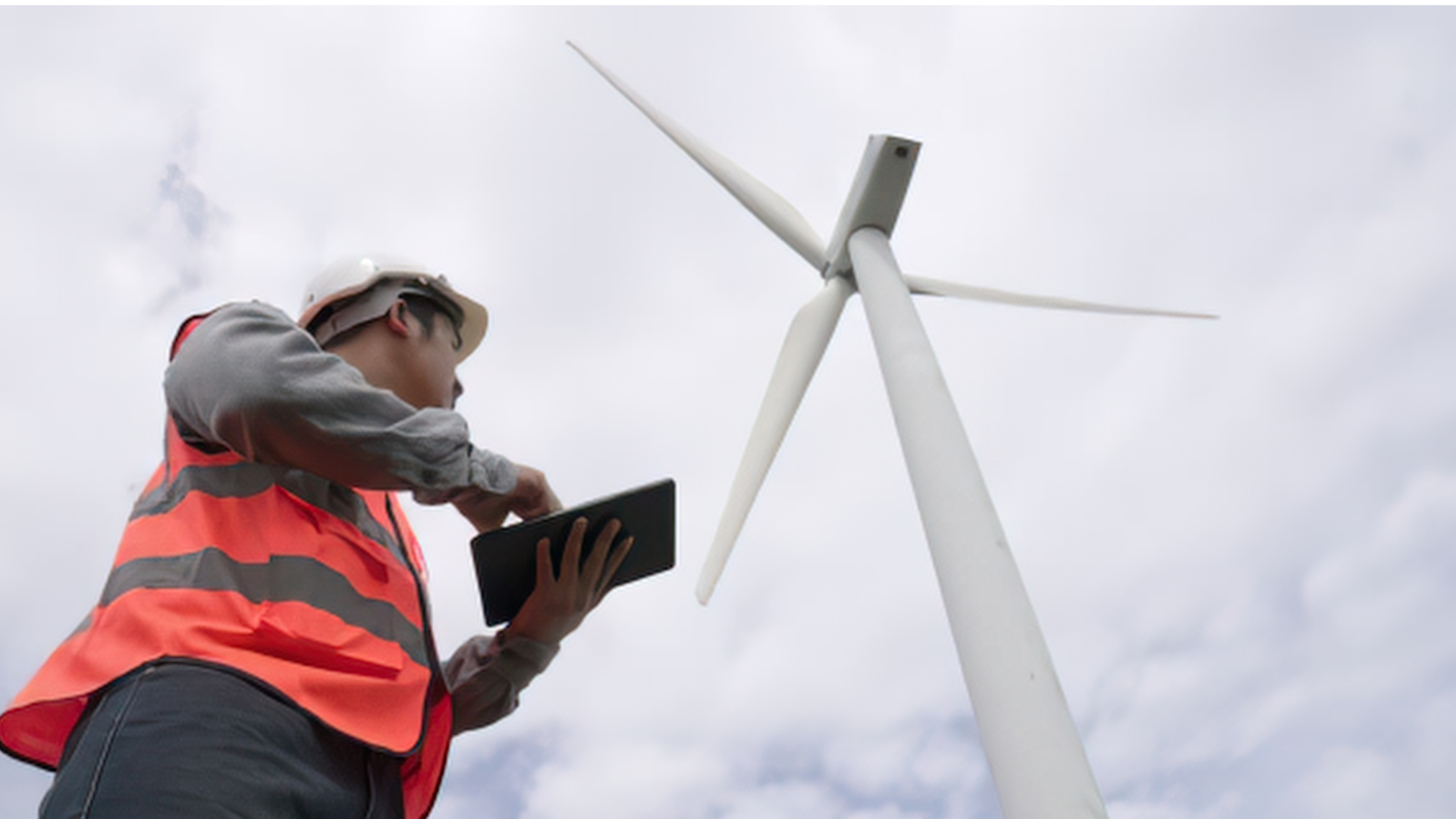 Wind turbine technician capturing a structured inspection record on a mobile device in the field